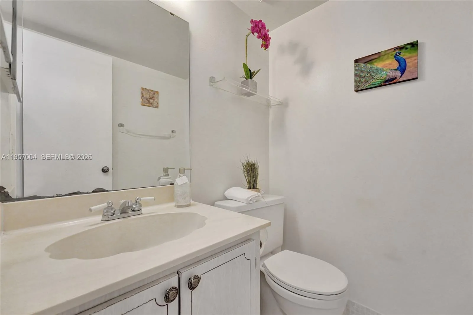 A convenient half bath with modern fixtures, perfect for guests.