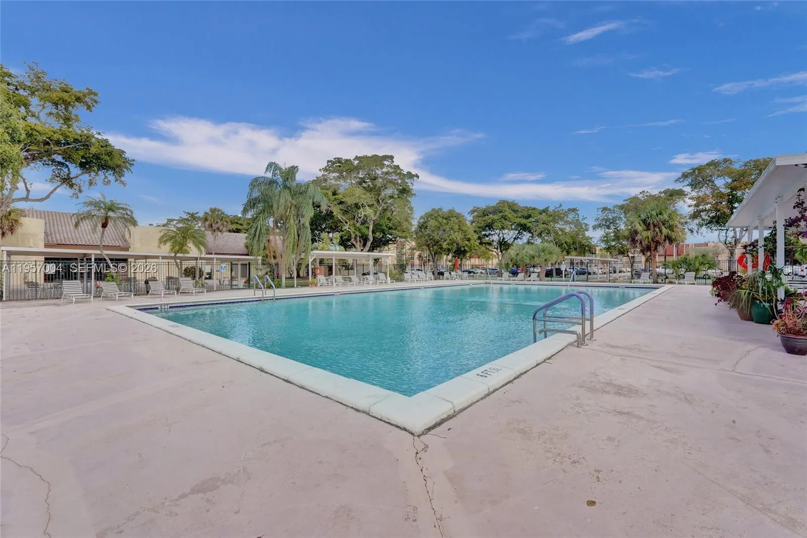 The condo features a relaxing pool area, perfect for unwinding and enjoying the sun in a tranquil setting.
