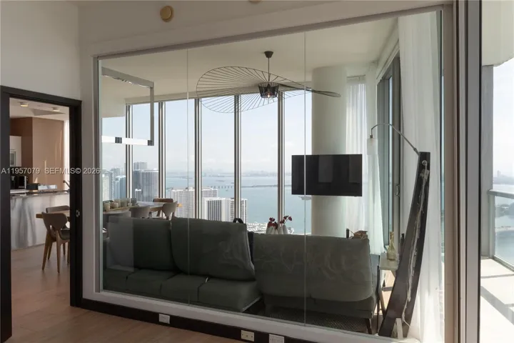 Glass wall in primary bedroom optimizing view exposure. This wall also has electric black out shades for full privact.