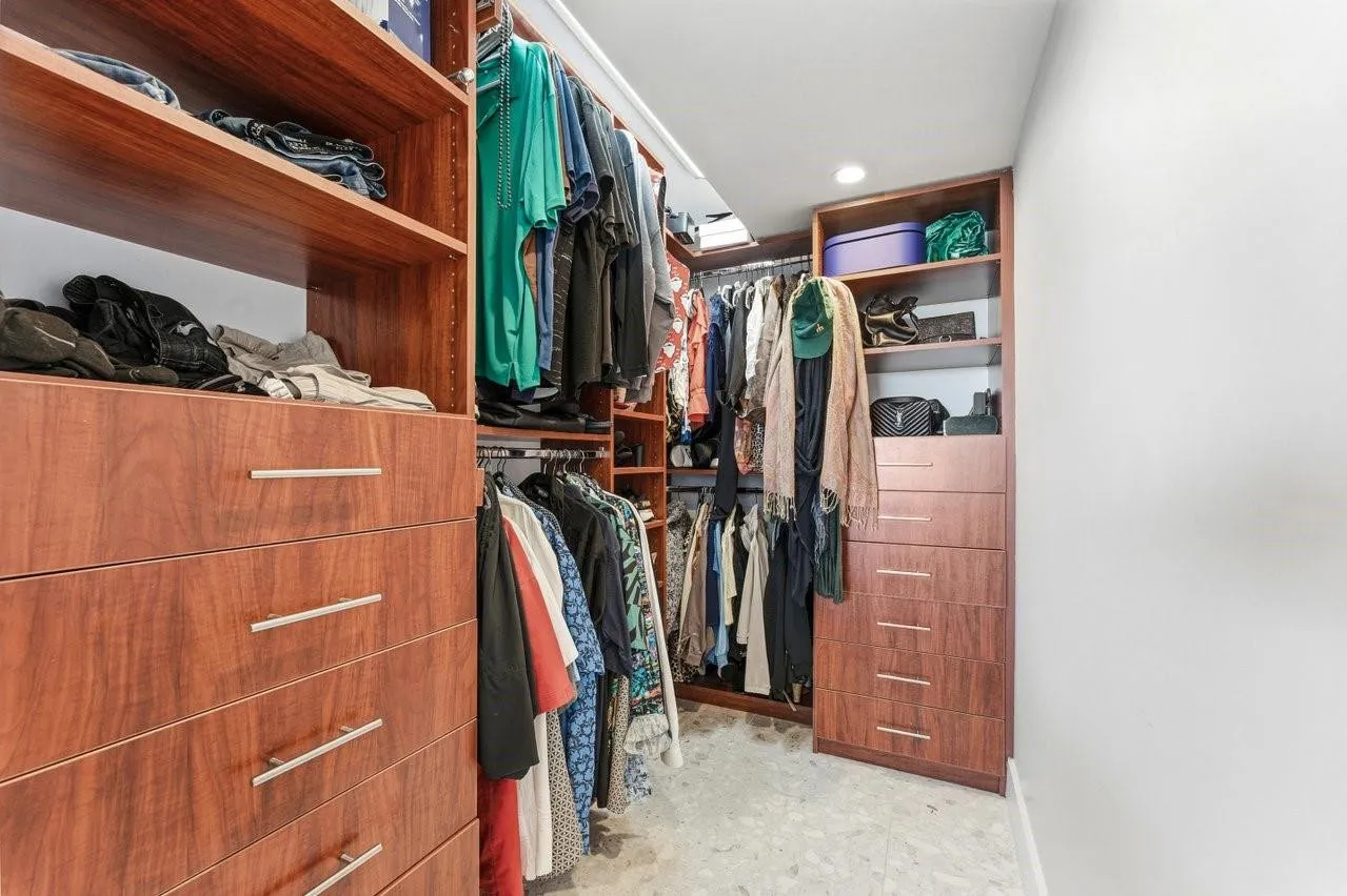 Primary bedroom walk-in closet