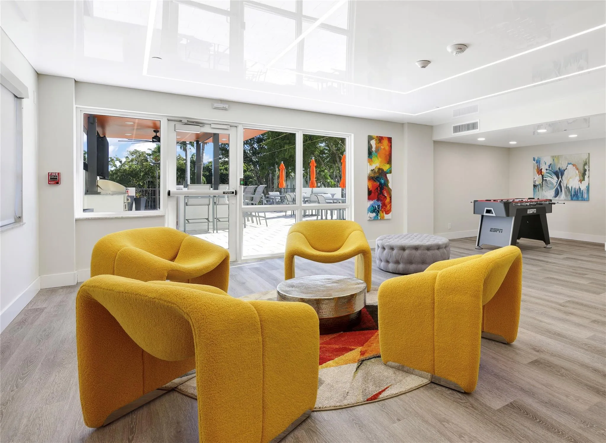 Recreation Room adjacent to the pool and pergola grill station for entertaining