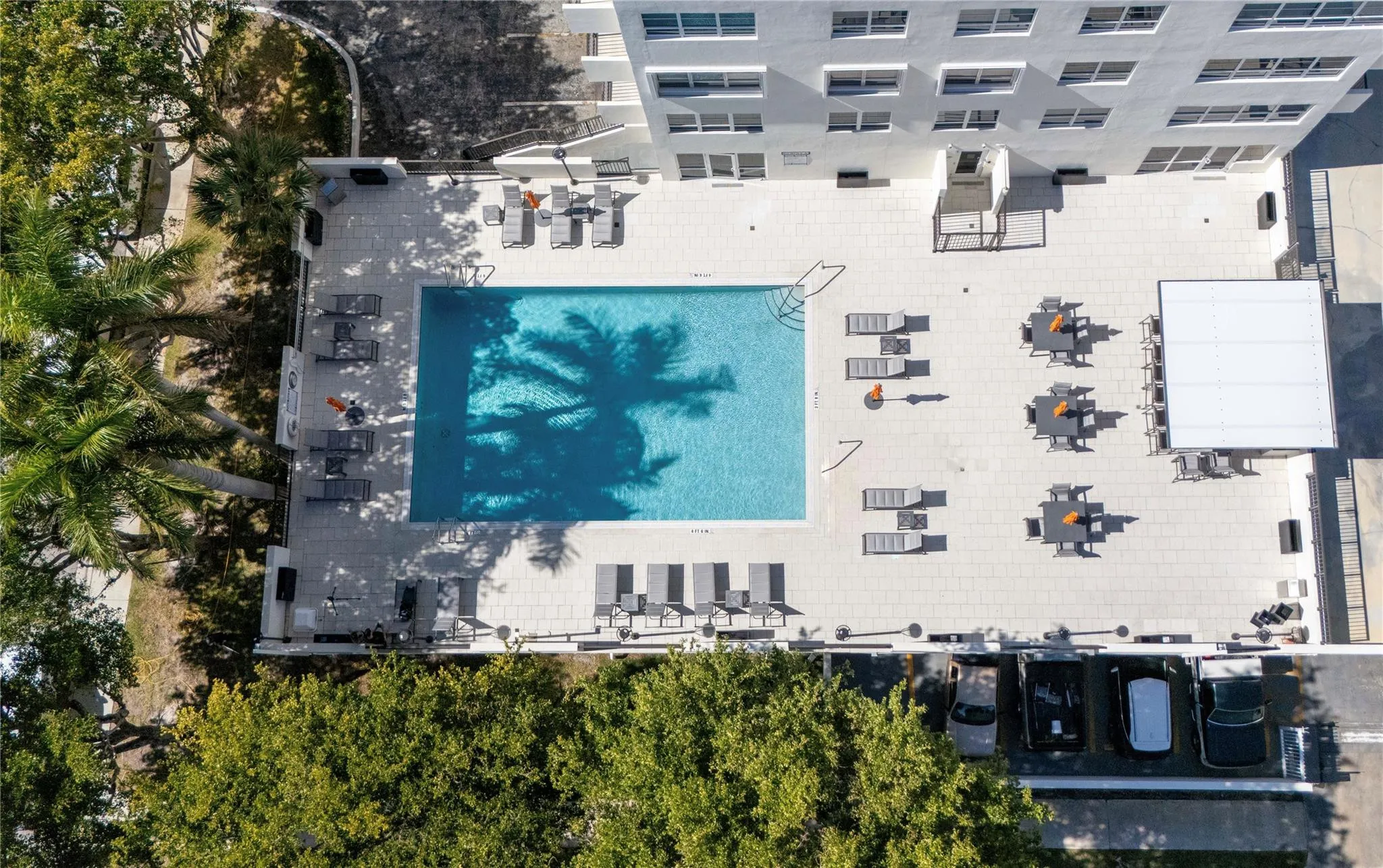 Zero edge heated pool and pool deck with pergola and Grill stations