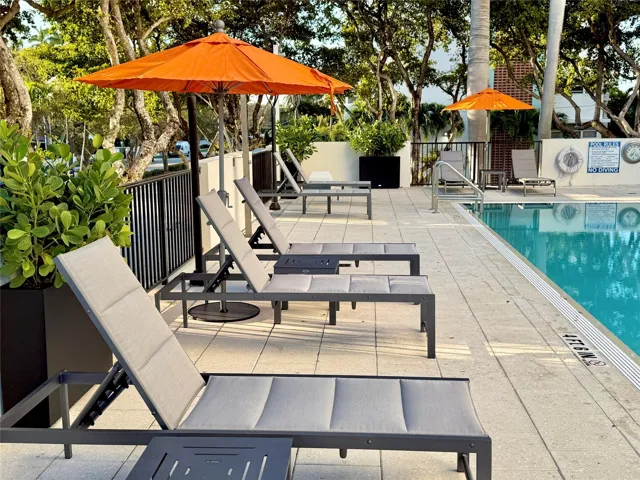 Lush Tropical trees surround the pool deck