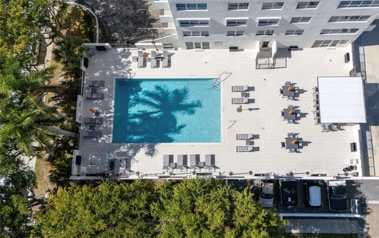 Zero edge heated pool and pool deck with pergola and Grill stations