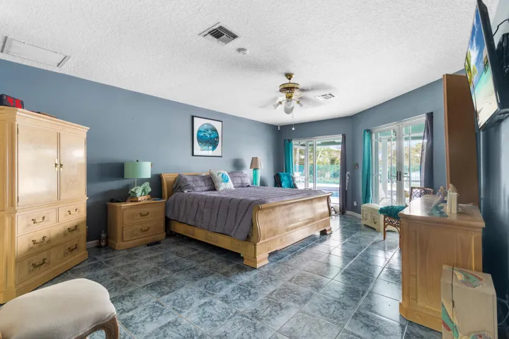 Master. Large walk in closet. 10 x 13. View and walk out to patio, pool, and lake.