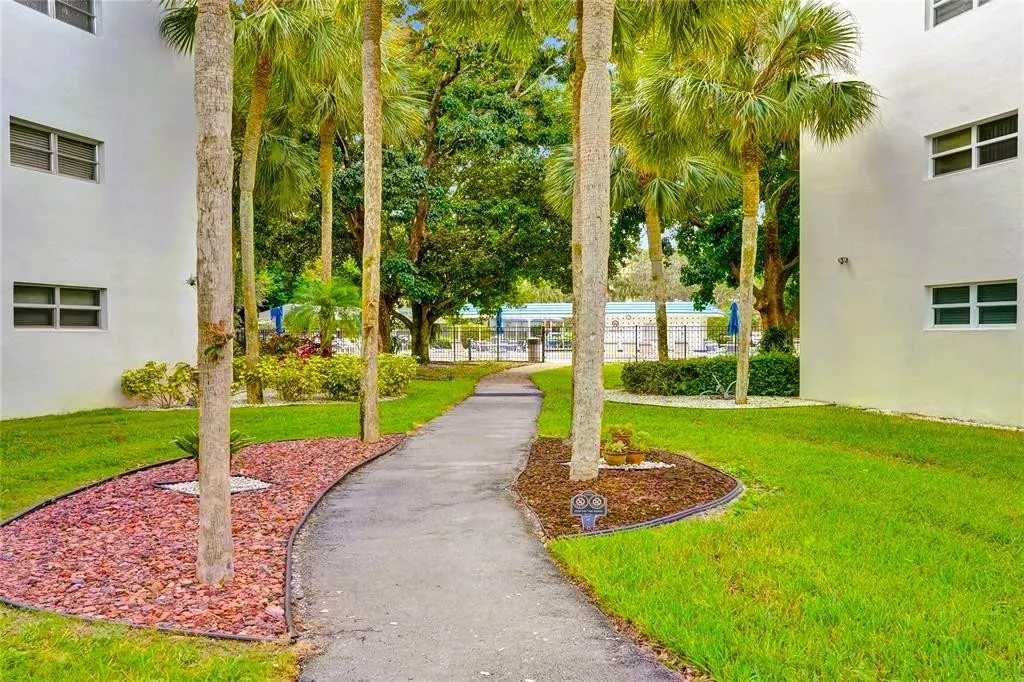 Walkway to Village with BBQPool