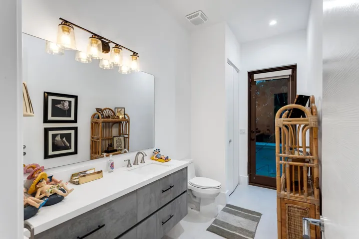 Cabana bath with direct pool access—perfect for effortless indoor-outdoor living.