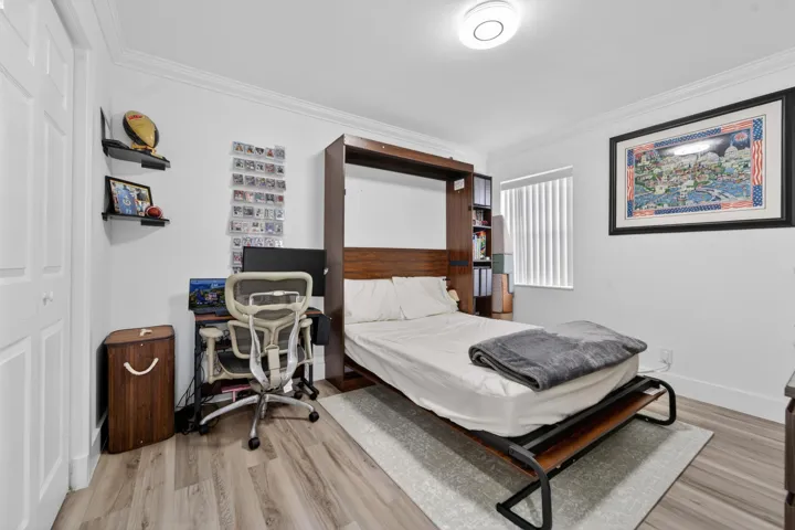 Second bedroom with open Murphy bed