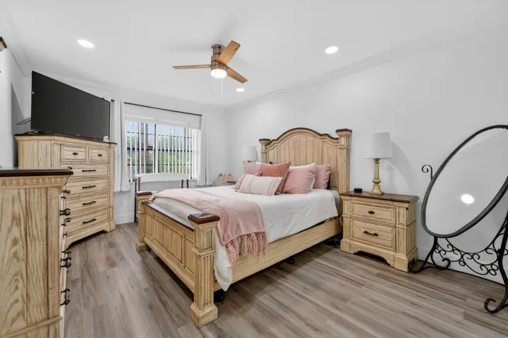 Primary bedroom with ceiling fan