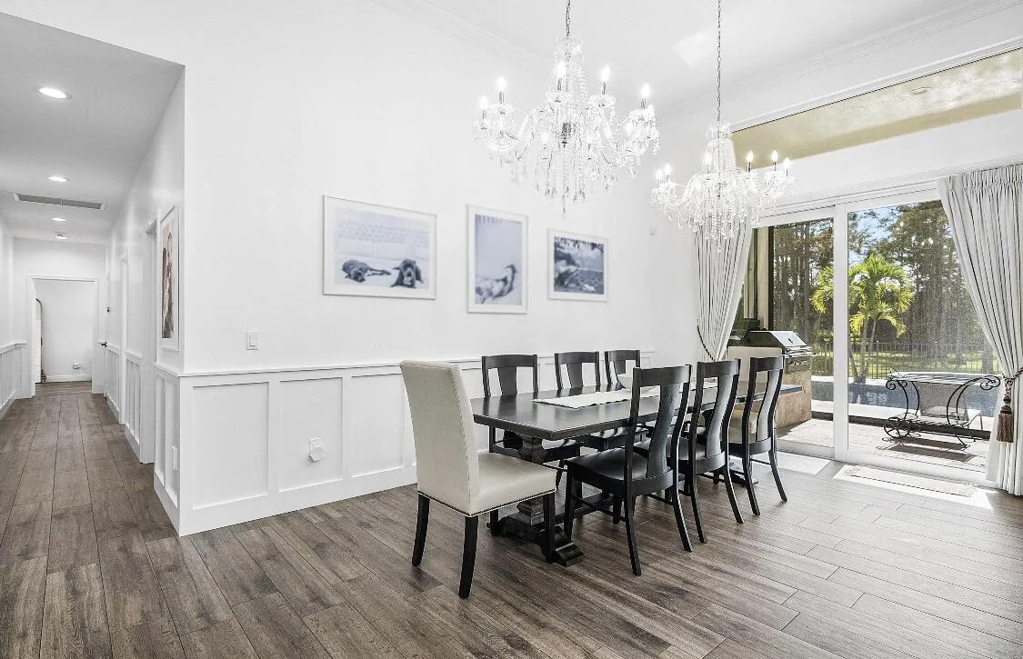 Formal Dining Room overlooking the pool, golf course and panoramic lake views.