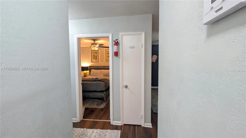 View of bedroom#1 from the living room area. Bedroom1 is located to the right hand side of the entrance hallway.