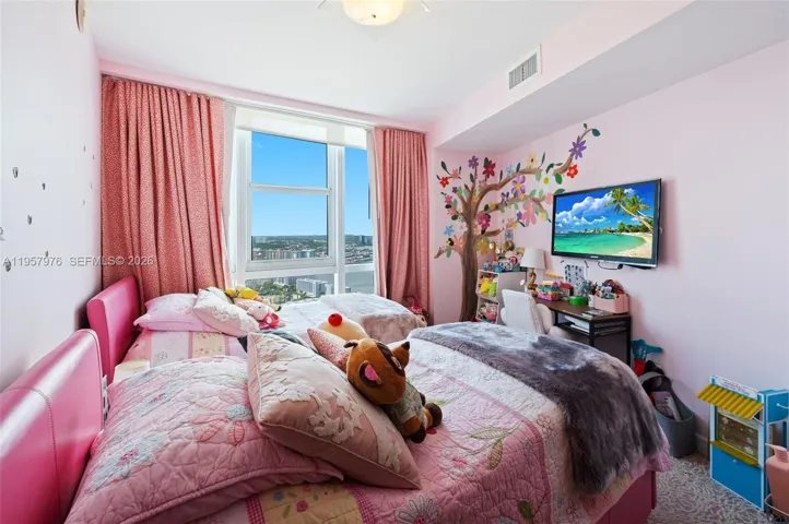 Children’s bedroom with custom mural and playful design.