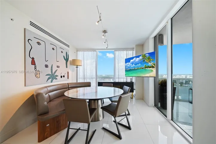 Breakfast or casual dining area with balcony access and abundant natural light.