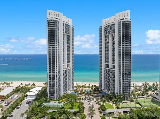 Iconic twin towers with direct private beach access