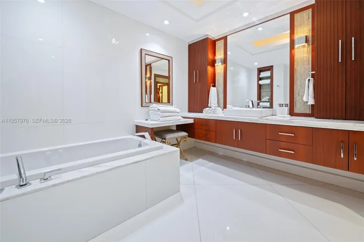 Spacious soaking tub and designer finishes.