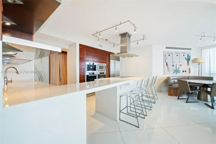 Expansive island with bar seating, perfect for casual dining and entertaining.