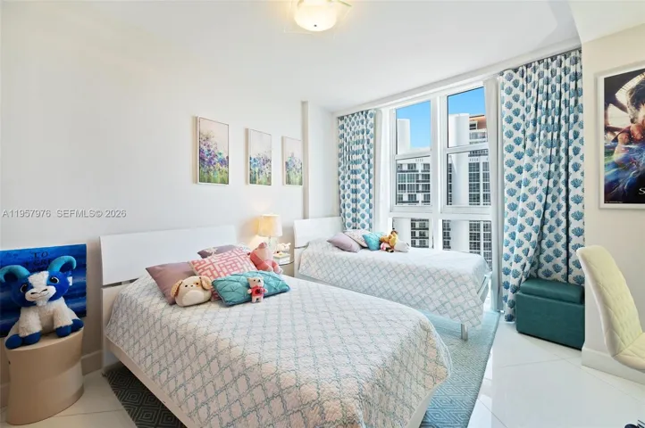 Secondary bedroom with bright natural light.