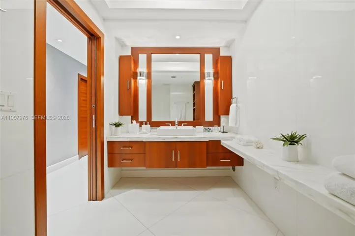 Elegant primary bath with dual vanities and custom cabinetry.