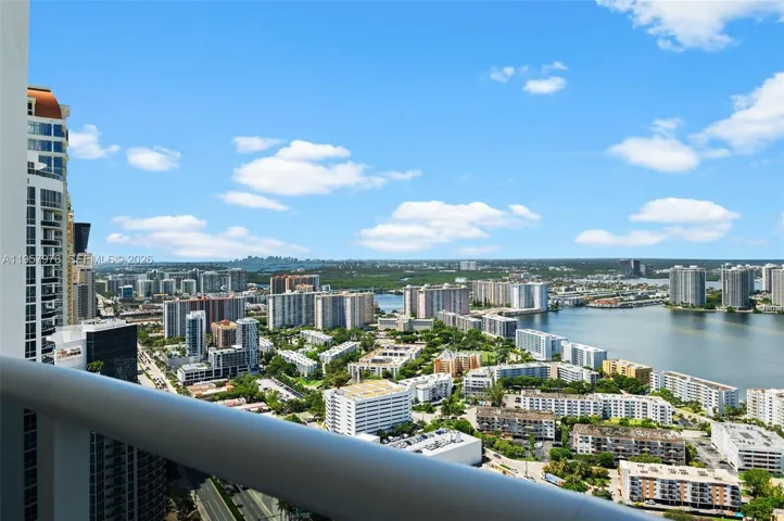 Panoramic coastline and luxury high-rise skyline views.