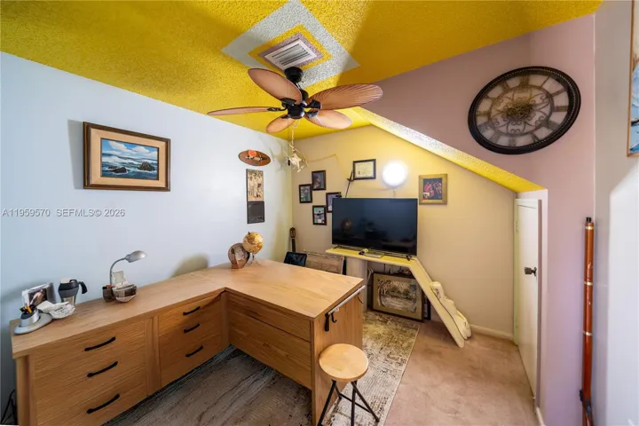 den with closet used as an office