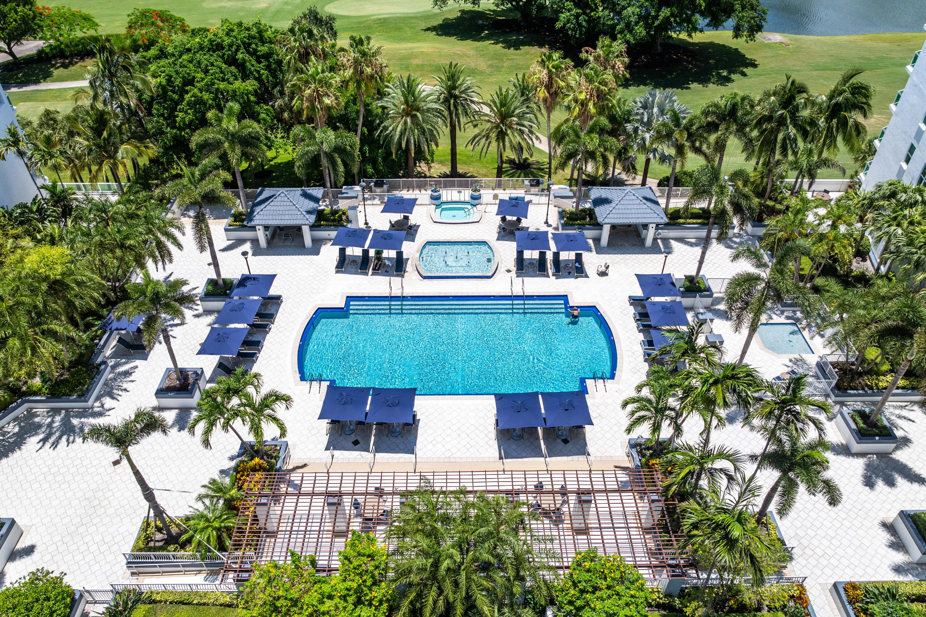Resort style pool, spa, and sun deck with gorgeous golf course views