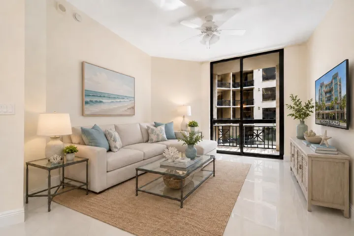 Bright Living area with Balcony overlooking courtyard. AI Staged