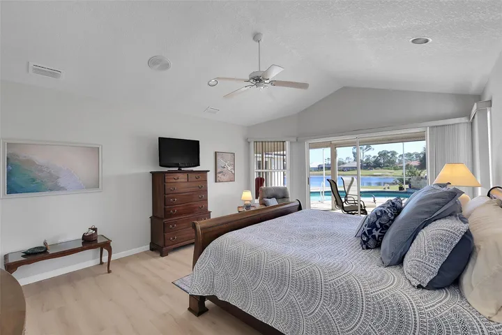 Primary bedroom includes a large walk-in closet. Textured walls and ceiling throughout. What a view to wake up to!