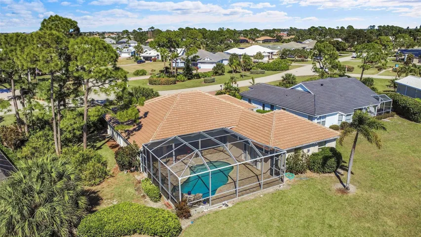 Aerial perspective looking northeast. The tropical landscaping provides lots of privacy for pool area.