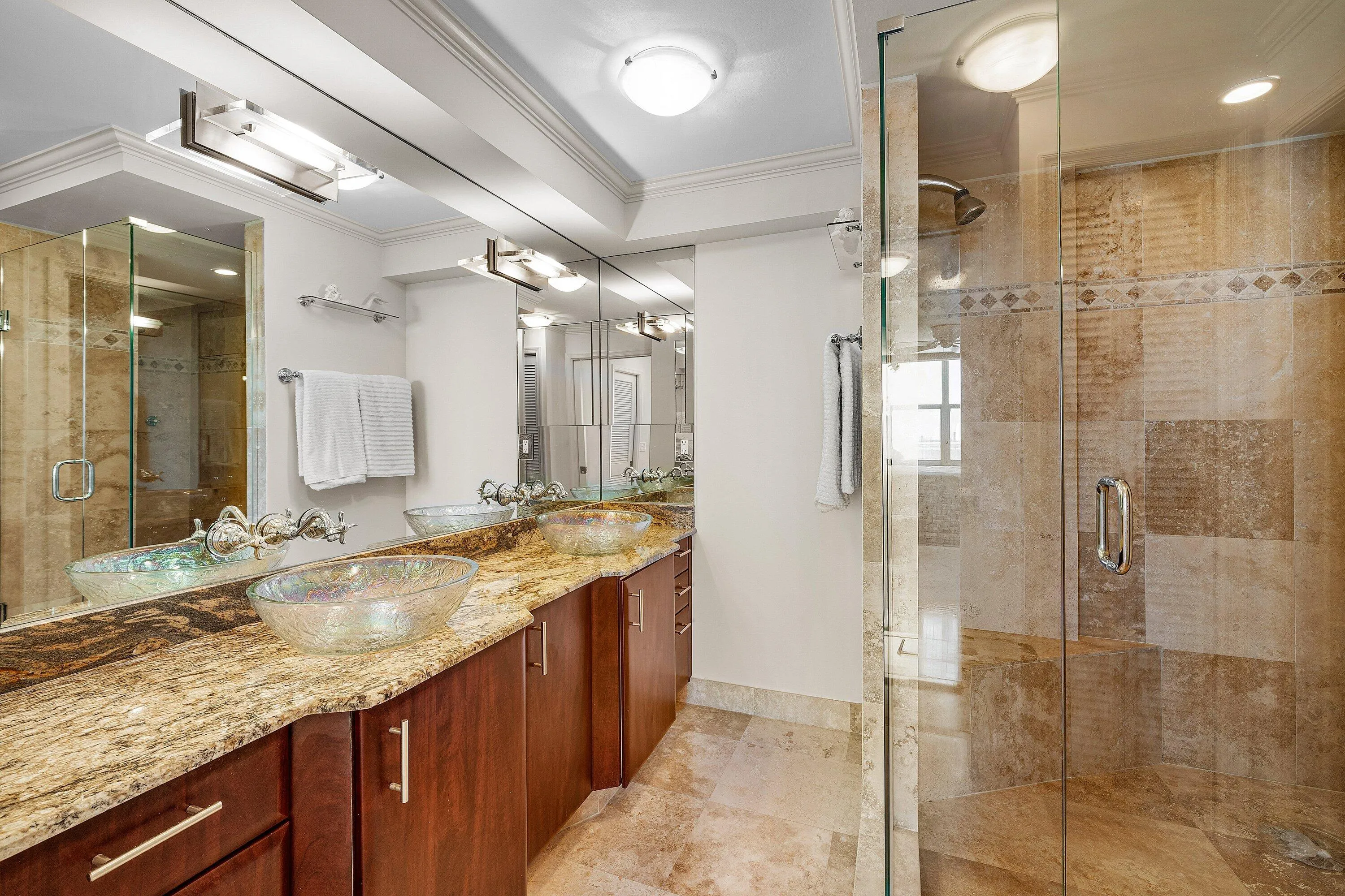 Dual sinks and large walk in shower in the main bathroom