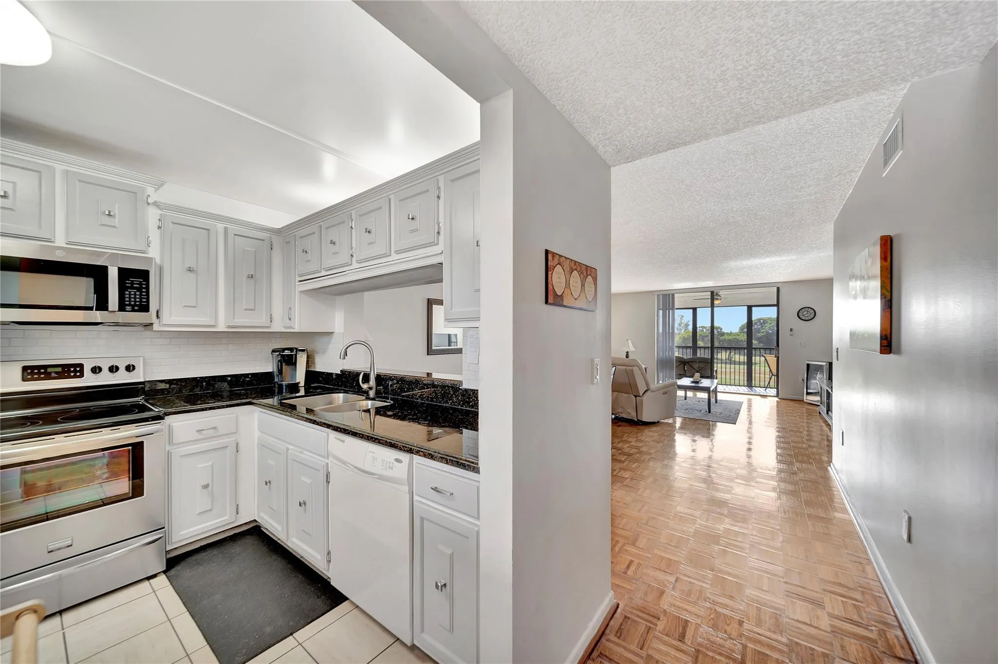 KITCHEN AND ENTRY TO LIVING ROOM