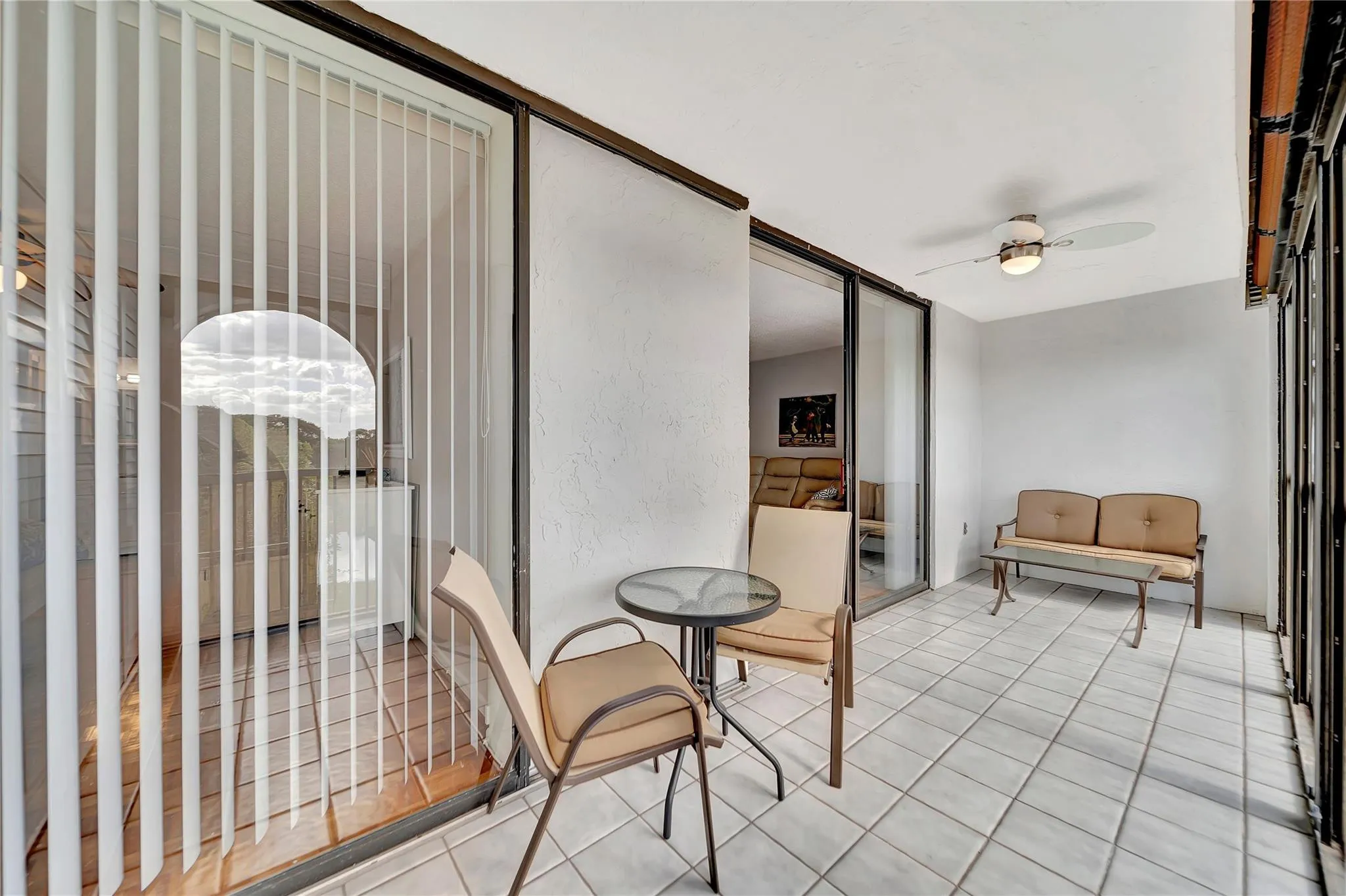 HUGE SCREENED BALCONY WITH ENTRY TO MASTER SUITE AND LIVING ROOM