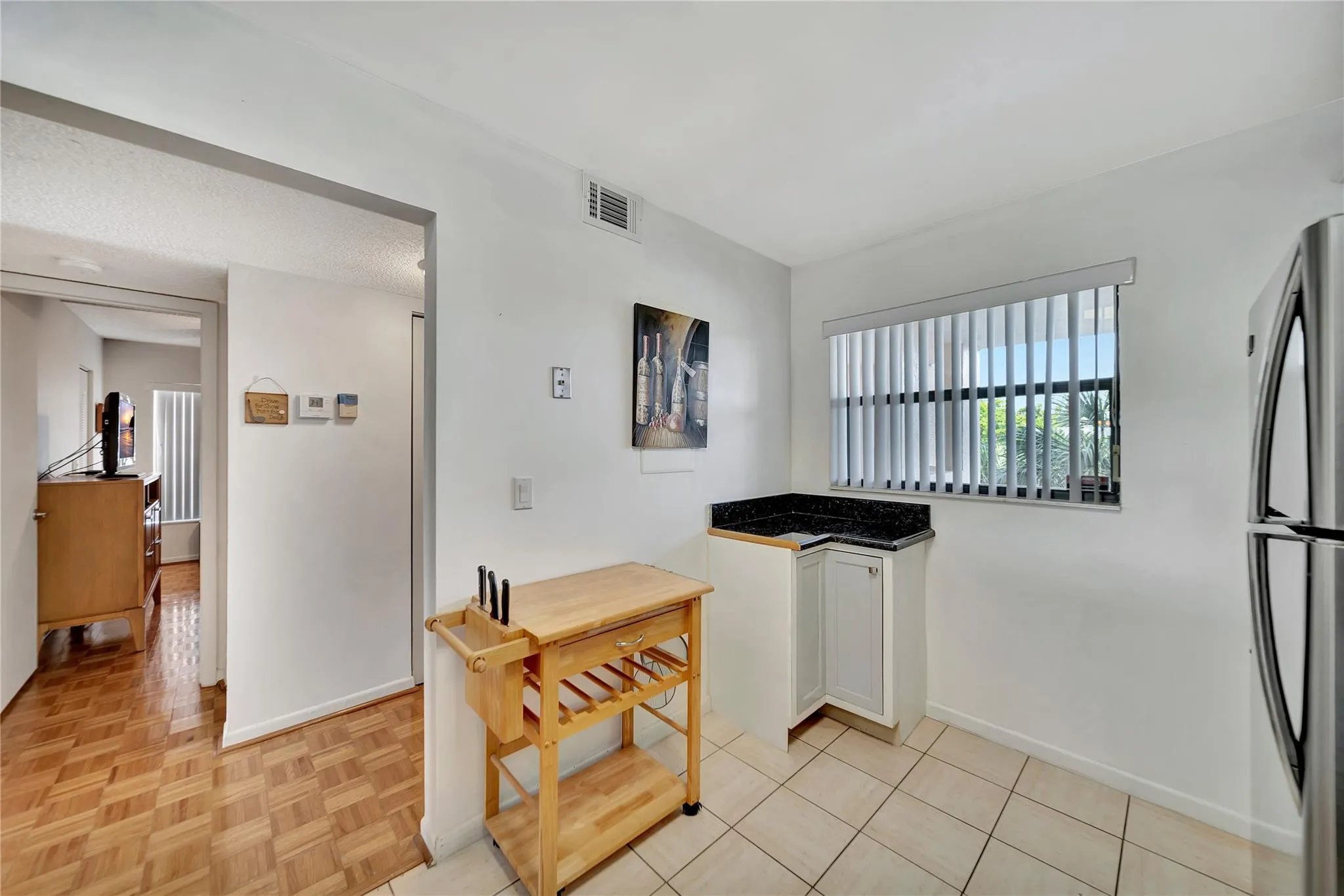 KITCHEN & ENTRY TO GUEST BEDROOM