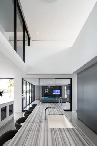Kitchen Island with view of Rec Room