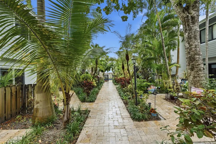 Beautifully landscaped courtyard welcomes you home and sets the tone for the charm and character found throughout this boutique townhome community.