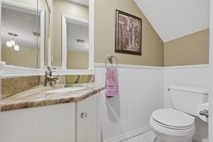 Convenient first floor half bathroom thoughtfully located for everyday living and entertaining.