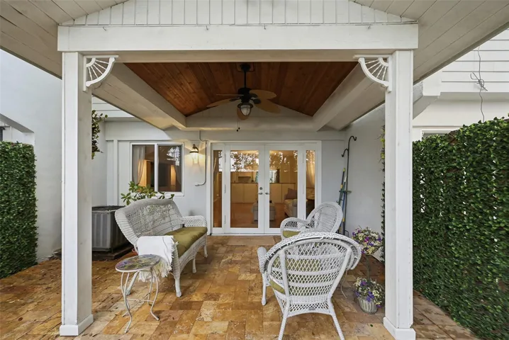 Private backyard offers the perfect combination of open and covered outdoor space for relaxing or entertaining.