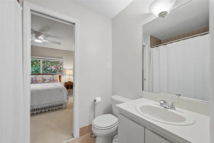 Spacious vanity in the Jack and Jill bathroom provides comfort, functionality, and ample storage.