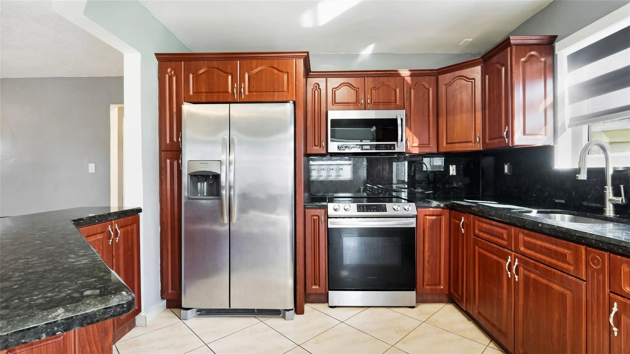 Spacious kitchen with Stainless Steel Appliances, Cherry wood Cabinets, Granite counters!