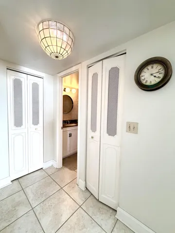 HALLWAY W LINEN & UTILITY CLOSETS