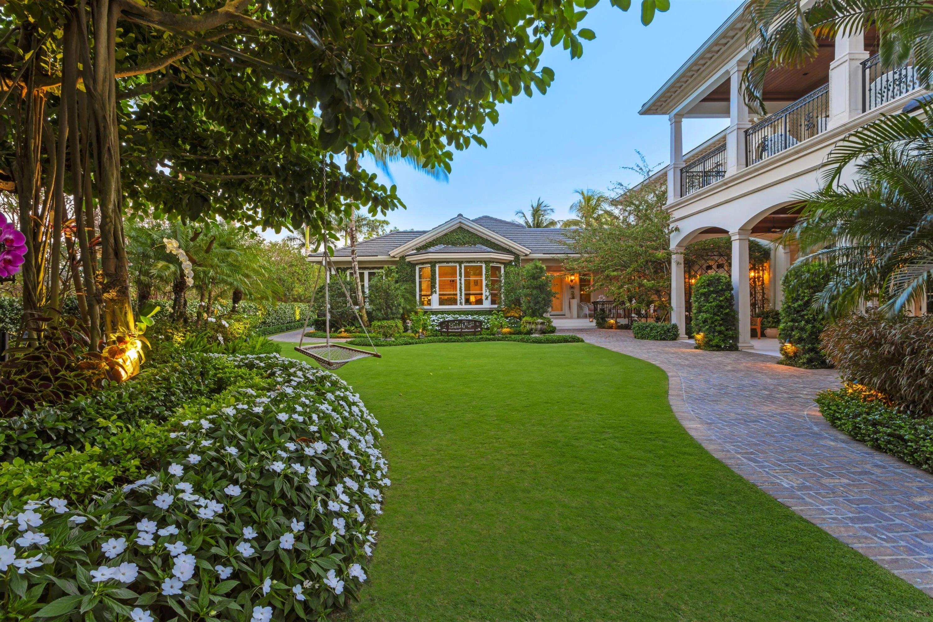 Expansive gardens w/aged banyan trees