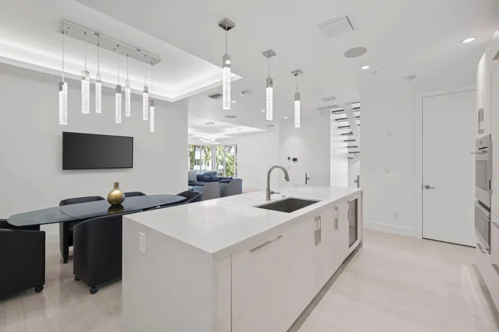 Extra large kitchen island with sink and wine cooler. Perfect for entertaining