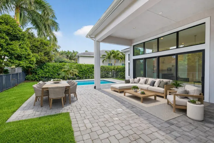 Contemporary patio with pool and greener