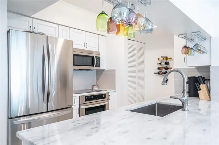 Recently renovated unit with Upgraded Kitchen, floors, appliances, lighting & more!