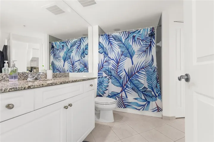 Spacious bath with newly refinished tub and dual access from the bedroom and living area