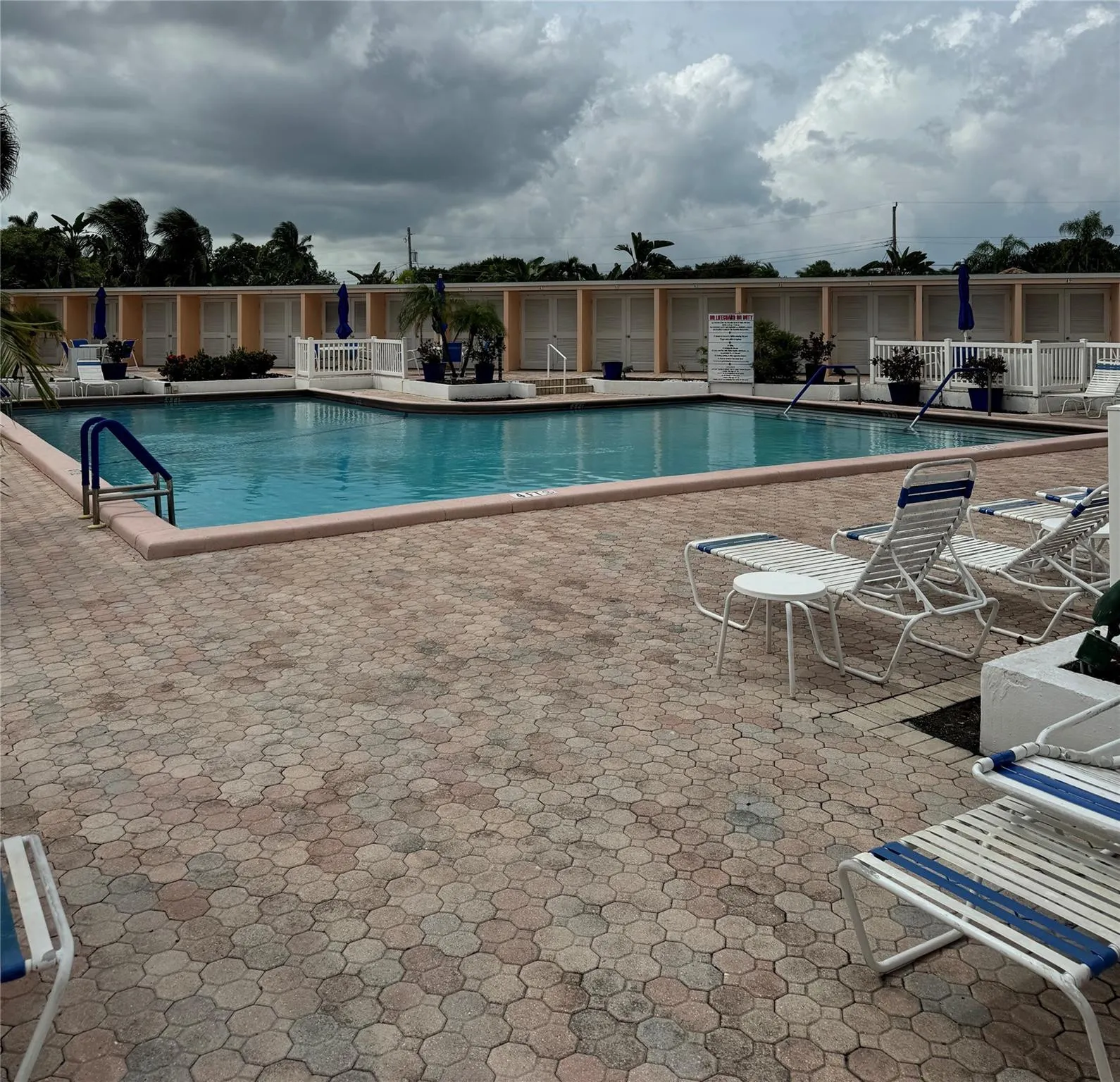 Large Pool with plenty of lounging areas ...