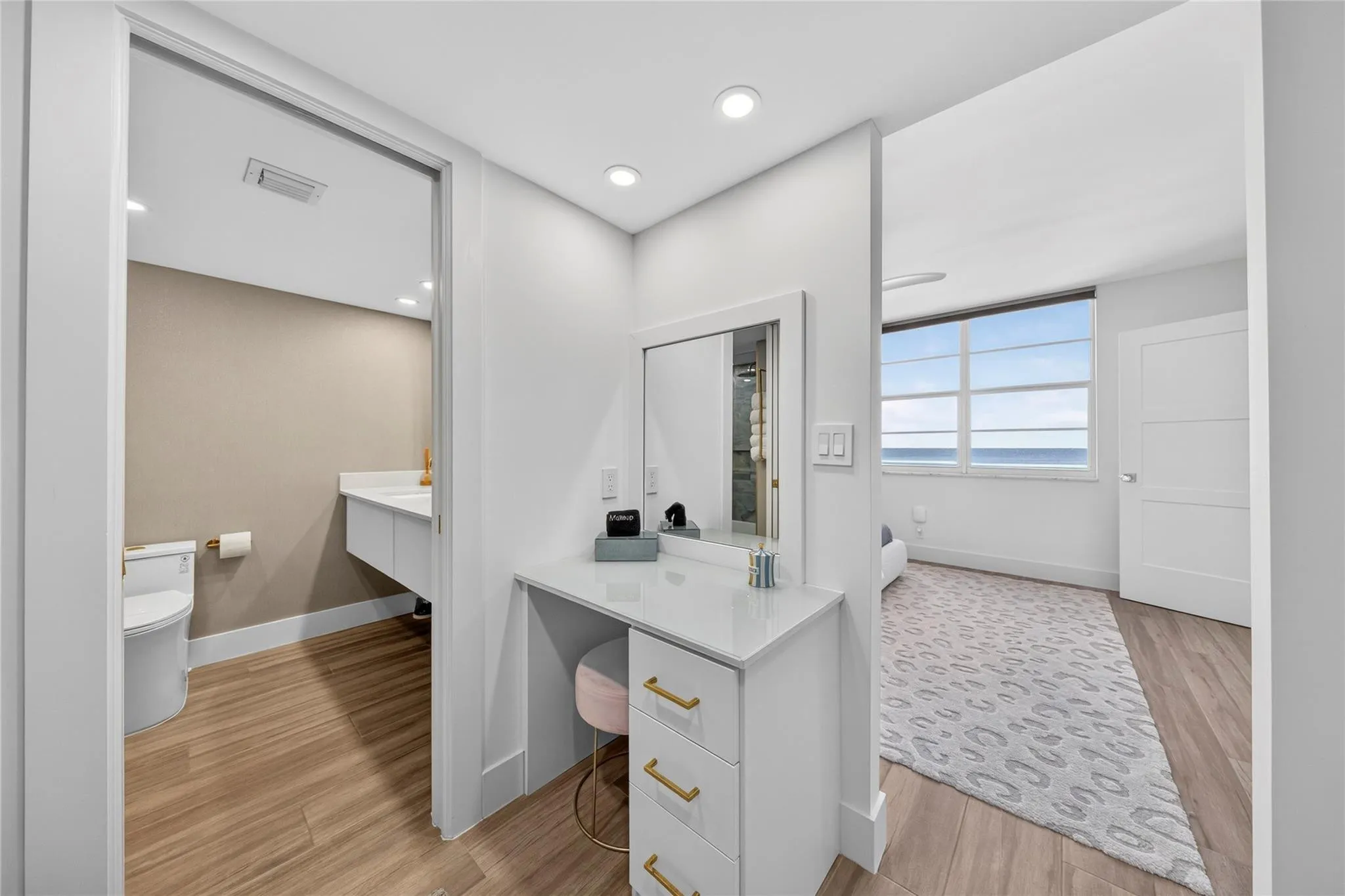 Dressing area and extra vanity in primary ensuite bath