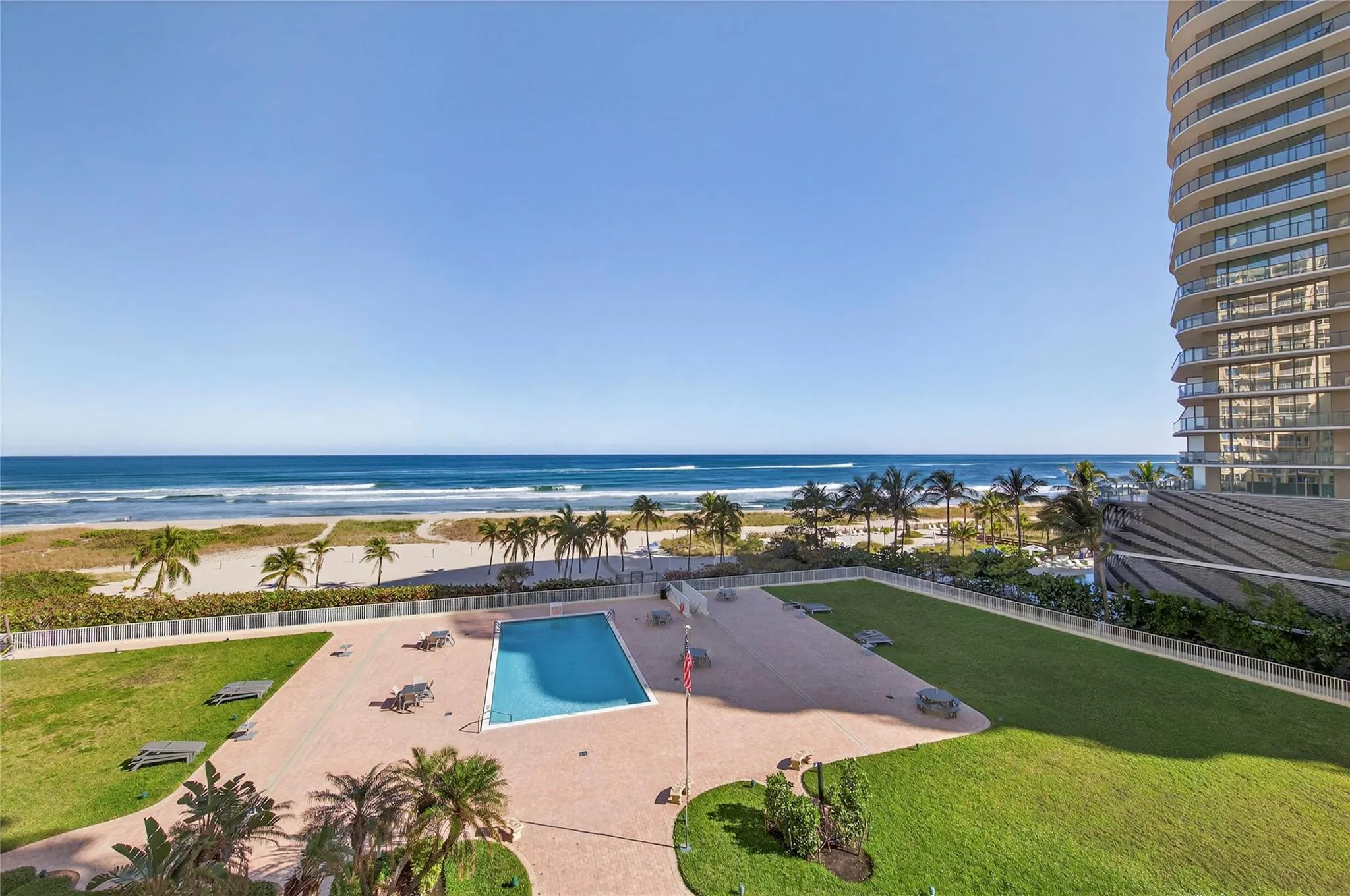 View of ocean and pool from balcony