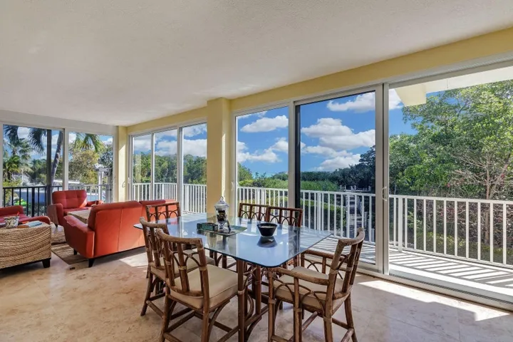 3-ENCLOSED WATERSIDE PORCH INCLUDES SITT