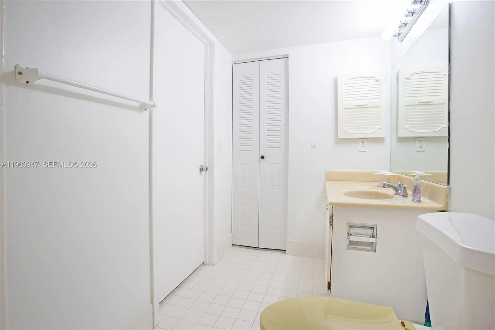 PRIMARY BATHROOM WITH VANITY AND LINEN CLOSET