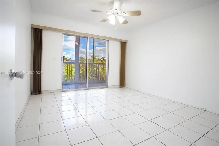 GUEST BEDROOM LEADING TO BALCONY